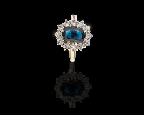 3.8 grams 14 carat Yellow Gold Sapphire and Diamond Halo Ring