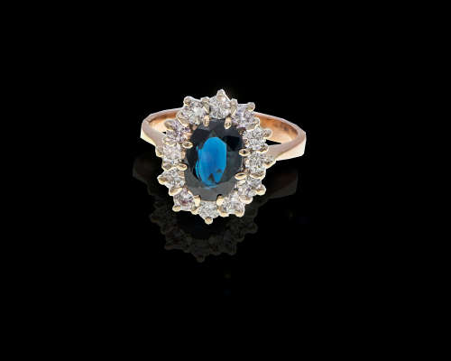 3.8 grams 14 carat Yellow Gold Sapphire and Diamond Halo Ring