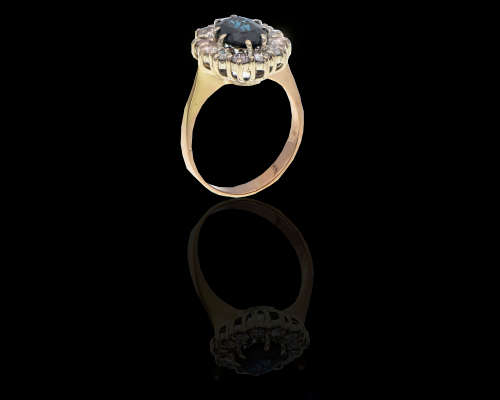 3.8 grams 14 carat Yellow Gold Sapphire and Diamond Halo Ring