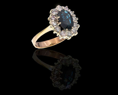 3.8 grams 14 carat Yellow Gold Sapphire and Diamond Halo Ring