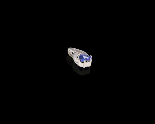 0.7 grams 9 carat White Gold Tanzanite and Diamond Pendant