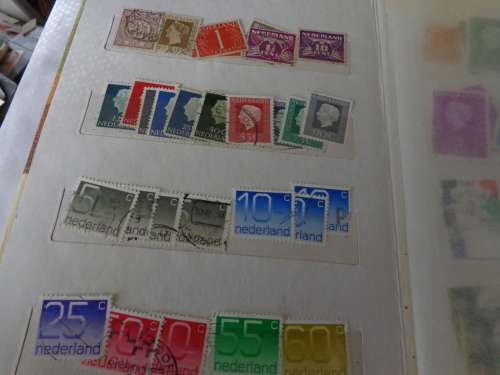 SMALL ALBUM FILLED WITH NETHL. AND HUNGARY STAMPS..(ESTATE)
