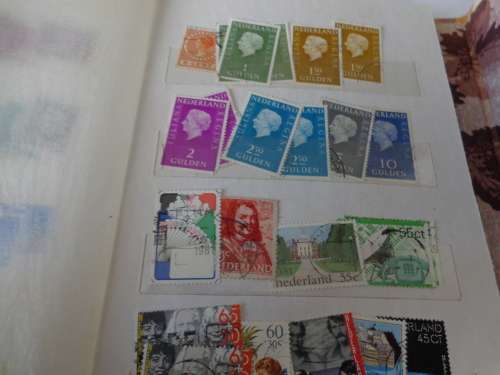 SMALL ALBUM FILLED WITH NETHL. AND HUNGARY STAMPS..(ESTATE)
