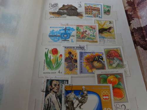 SMALL ALBUM FILLED WITH NETHL. AND HUNGARY STAMPS..(ESTATE)