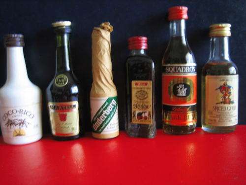 Unopened..coco rico./martell,cognac.undb/bitters.2 skilde/cher.squad/rum.s/gold...