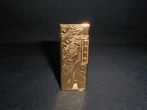 Gold colour gas lighter with patterns - as per scan