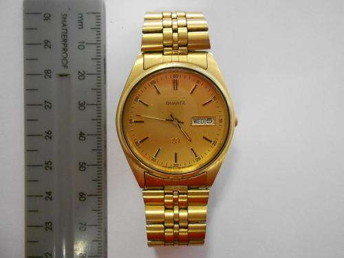 Seiko gold coloured mens quartz wristwatch - as per scan