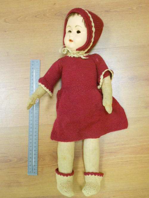 Composition doll with red coat, eyes are missing - as per scan