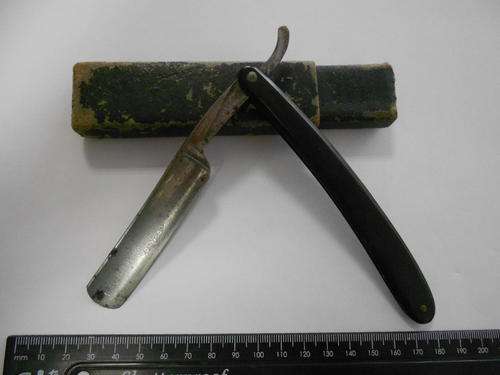 John Milner and Co. Real Ring cut throat razor, little rust on blade and box have no lid