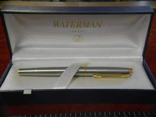 Waterman fountain pen in original box, stainless steel with gold colour trimmings - as per scan