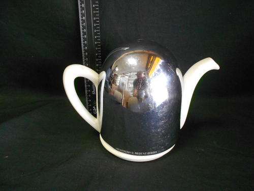 Porcelain teapot with stainless steel heat lid without handle - as per scan