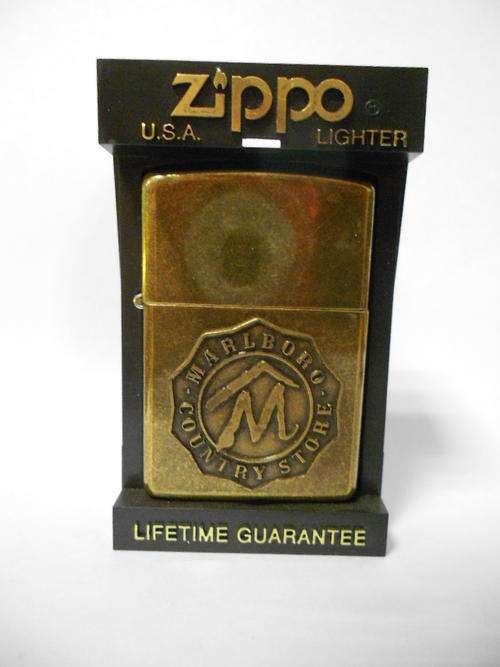 Marlboro Country Store ZIPPO, brass in Zippo case, still sealed lid - as per scan
