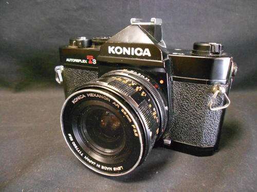 Konica Autoreflex T3 camera with Konica Hexanon AR 28mm F3.5 lens - as per scan