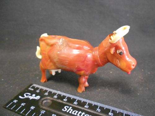 Plastic moulded cow with ''milk'' pump action when lifting tail, by tudor rose, CRAZY WEDNESDAY