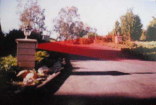 Car approaching house