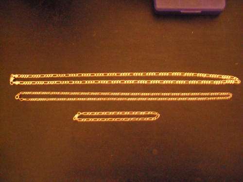 Two gold chains and a bracelet
