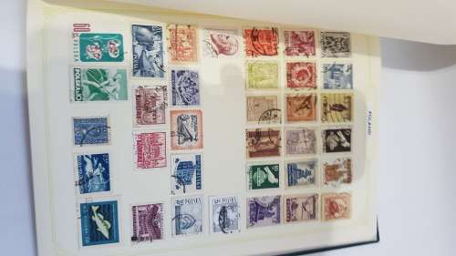 Large Stanley Gibbons stamp album full of stamps from all over the world!!!!!