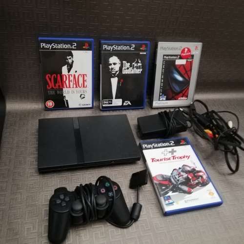 Sony Playstation 2 complete tested working 100% with four games!!!!