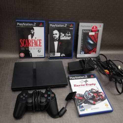 Sony Playstation 2 complete tested working 100% with four games!!!!