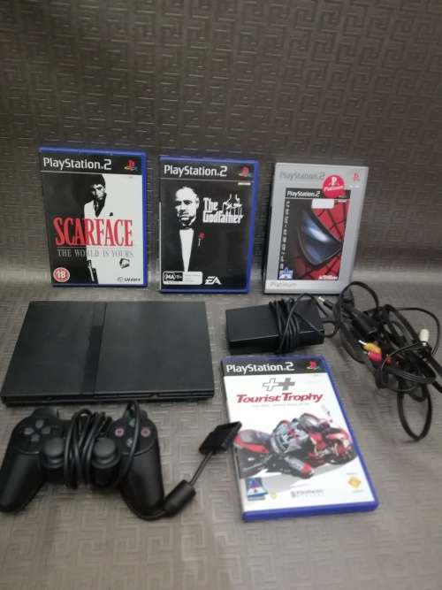 Sony Playstation 2 complete tested working 100% with four games!!!!