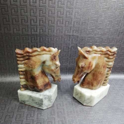 Two stunning marble horse bookends bid for both