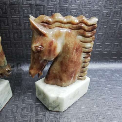 Two stunning marble horse bookends bid for both