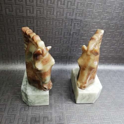 Two stunning marble horse bookends bid for both