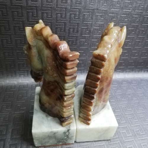 Two stunning marble horse bookends bid for both