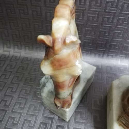 Two stunning marble horse bookends bid for both