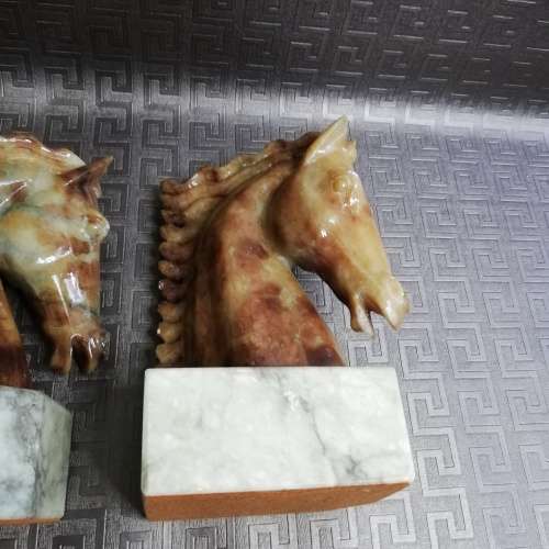 Two stunning marble horse bookends bid for both