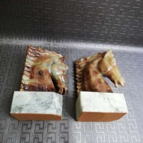 Two stunning marble horse bookends bid for both