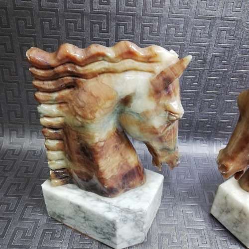 Two stunning marble horse bookends bid for both