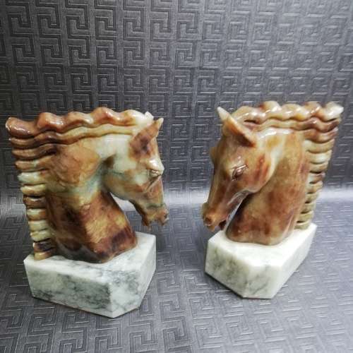 Two stunning marble horse bookends bid for both