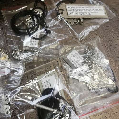 Wooden case with a large collection of necklaces and pieces bid for all!!!!
