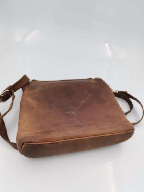 LEATHER BAG STRAPE NEEDS TO BE FIXED!!!