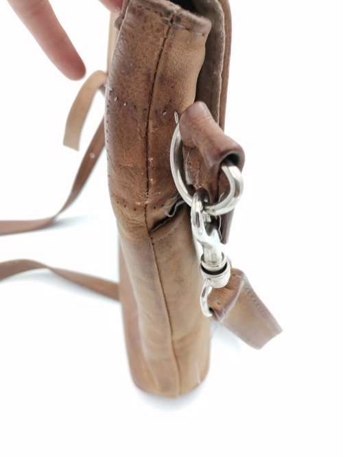 LEATHER BAG STRAPE NEEDS TO BE FIXED!!!