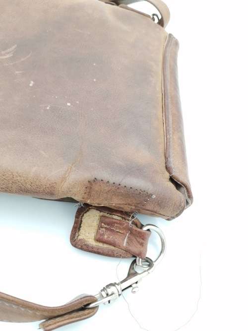 LEATHER BAG STRAPE NEEDS TO BE FIXED!!!