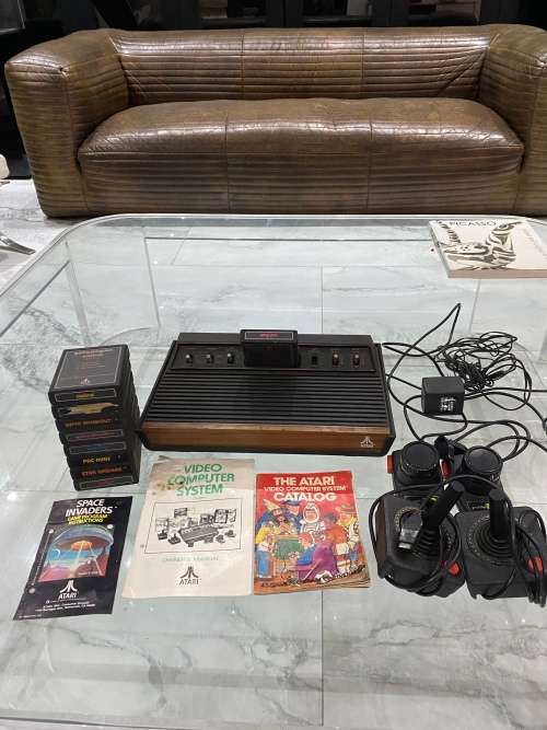 VINTAGE ATARI 2600 COMPLETE TESTED AND WORKING WITH A WHOLE COLLECTION OF GAMES BID FOR ALL !!!!