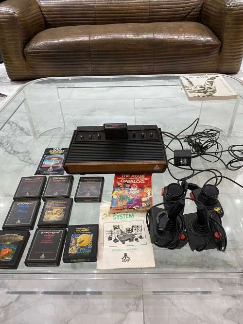 VINTAGE ATARI 2600 COMPLETE TESTED AND WORKING WITH A WHOLE COLLECTION OF GAMES BID FOR ALL !!!!