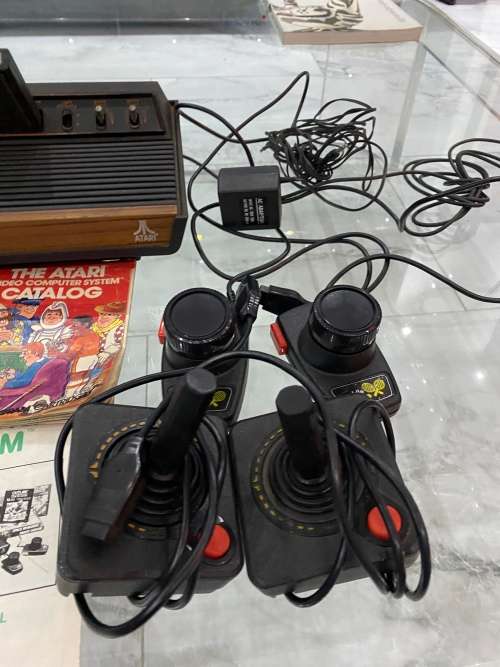 VINTAGE ATARI 2600 COMPLETE TESTED AND WORKING WITH A WHOLE COLLECTION OF GAMES BID FOR ALL !!!!