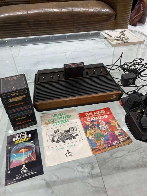 VINTAGE ATARI 2600 COMPLETE TESTED AND WORKING WITH A WHOLE COLLECTION OF GAMES BID FOR ALL !!!!