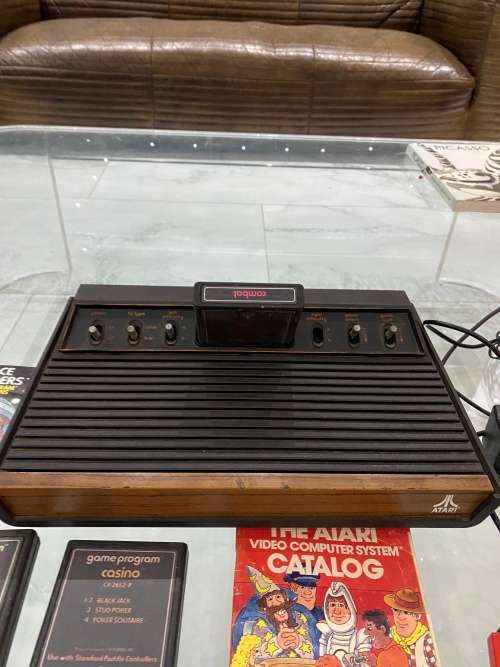 VINTAGE ATARI 2600 COMPLETE TESTED AND WORKING WITH A WHOLE COLLECTION OF GAMES BID FOR ALL !!!!