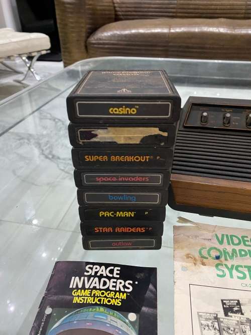 VINTAGE ATARI 2600 COMPLETE TESTED AND WORKING WITH A WHOLE COLLECTION OF GAMES BID FOR ALL !!!!