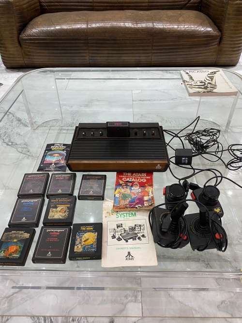 VINTAGE ATARI 2600 COMPLETE TESTED AND WORKING WITH A WHOLE COLLECTION OF GAMES BID FOR ALL !!!!