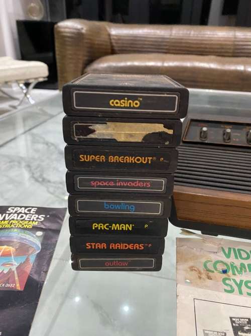 VINTAGE ATARI 2600 COMPLETE TESTED AND WORKING WITH A WHOLE COLLECTION OF GAMES BID FOR ALL !!!!
