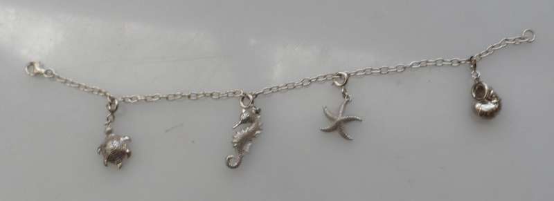 Silver charm bracelet ,turtle, sea horse, starfish,  & nautilus shell charms 800 mm / 31 ins length