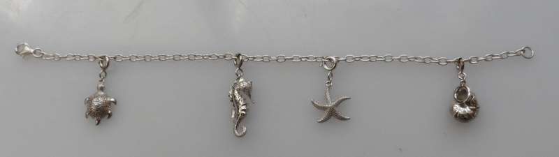 Silver charm bracelet ,turtle, sea horse, starfish,  & nautilus shell charms 800 mm / 31 ins length