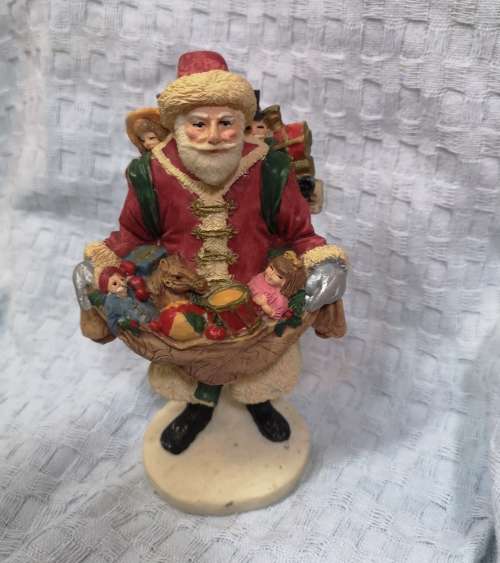 Vintage Santa Claus Figurine with gifts, ideal as shop window decor