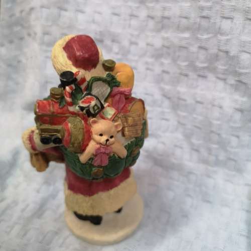Vintage Santa Claus Figurine with gifts, ideal as shop window decor