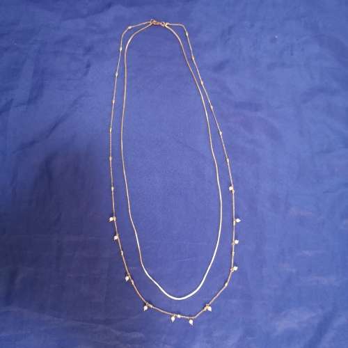 Layered strand chain necklace with hanging pearl detail